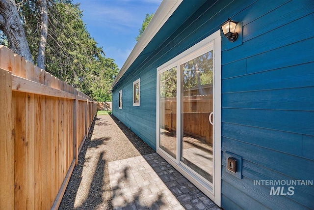 view of property exterior featuring a patio area