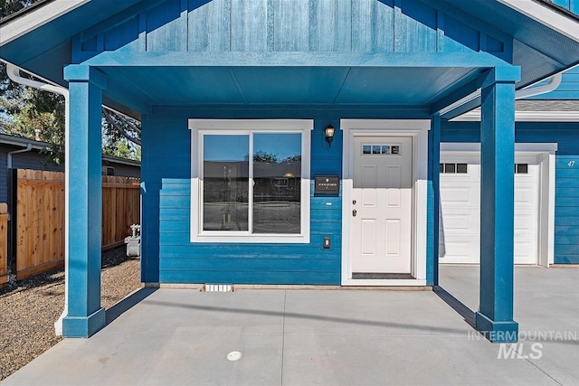 doorway to property featuring a garage