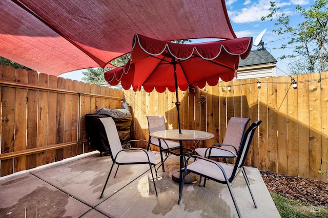 view of patio / terrace featuring a fenced backyard and outdoor dining space