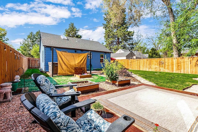 view of patio featuring a fenced backyard and a vegetable garden