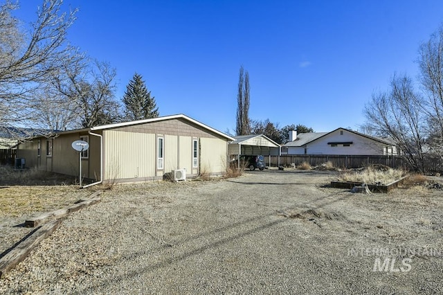 view of side of property featuring a carport