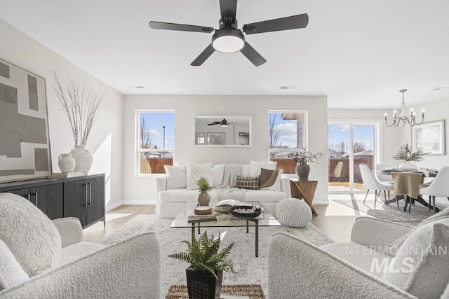 living room with an inviting chandelier and visible vents