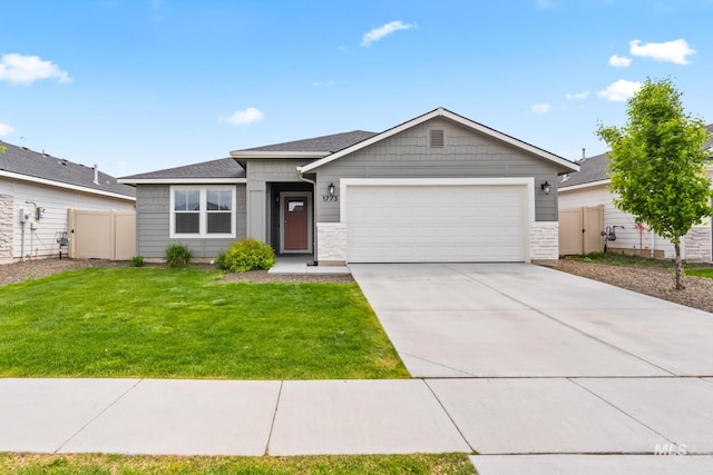 1773 E E Celbridge St, Nampa, ID 83686 - ranch-style house featuring a garage, driveway, and stone siding