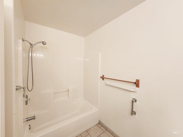 bathroom with shower / washtub combination and tile patterned flooring