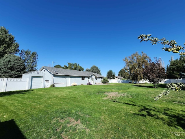 view of yard with a garage