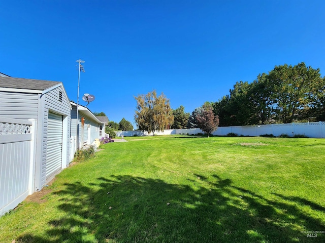 view of yard featuring a garage