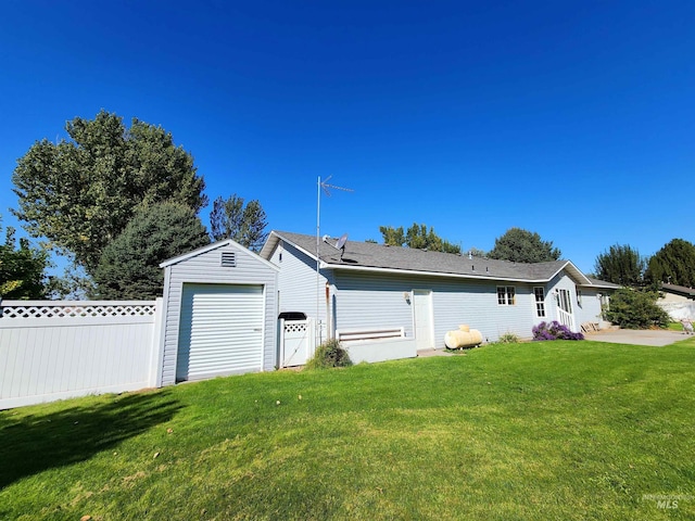 exterior space with a front lawn and a garage