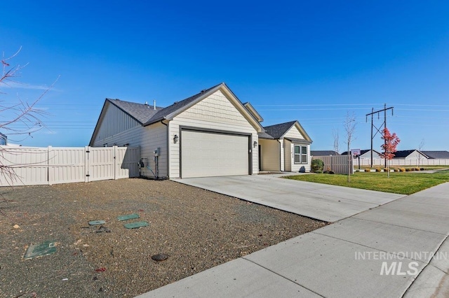 view of front of home with a garage and a front lawn