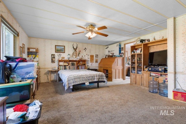 bedroom with carpet and wallpapered walls