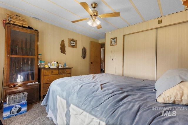 bedroom featuring a closet, carpet flooring, and ceiling fan
