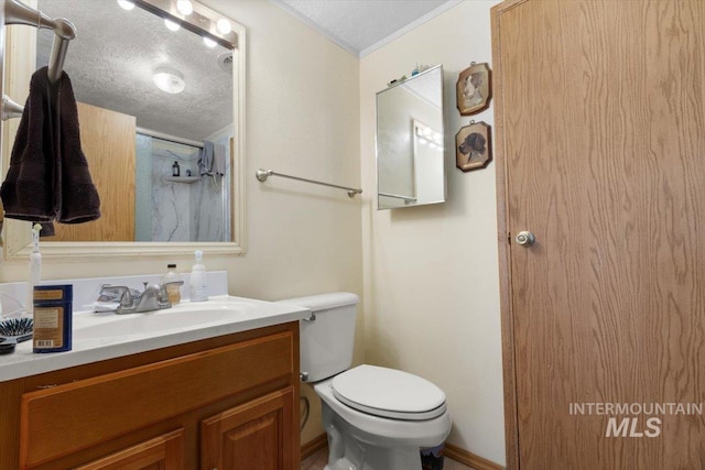 full bath with a textured ceiling, vanity, ornamental molding, toilet, and a shower