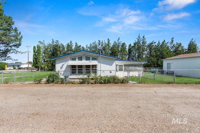 view of front of property with fence and a gate