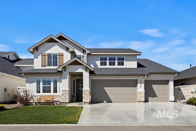 craftsman-style house with a garage, driveway, stone siding, and stucco siding
