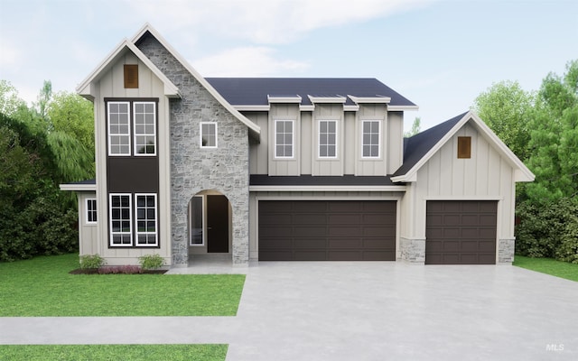 view of front of house with a garage and a front lawn