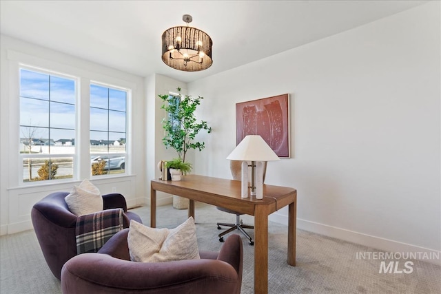 carpeted office space with a notable chandelier