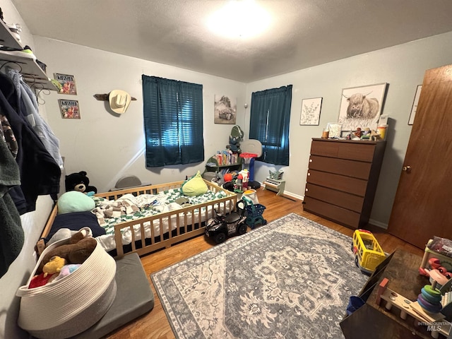 bedroom featuring hardwood / wood-style flooring