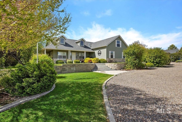 cape cod home with a front yard