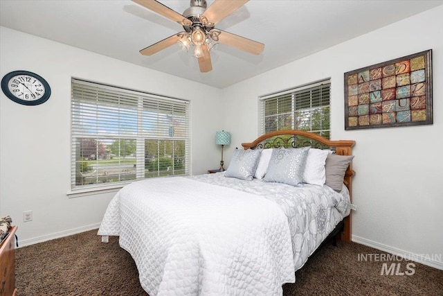 bedroom featuring ceiling fan and dark colored carpet