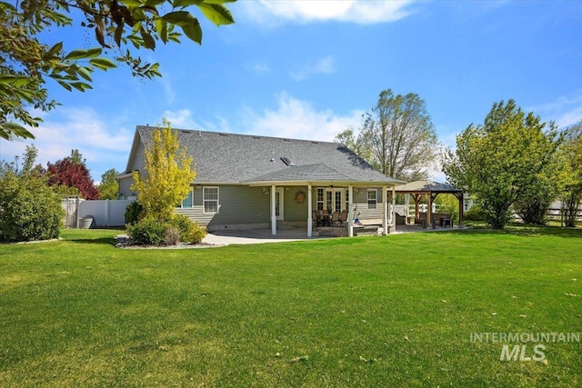 back of house with a yard, a patio area, and a gazebo