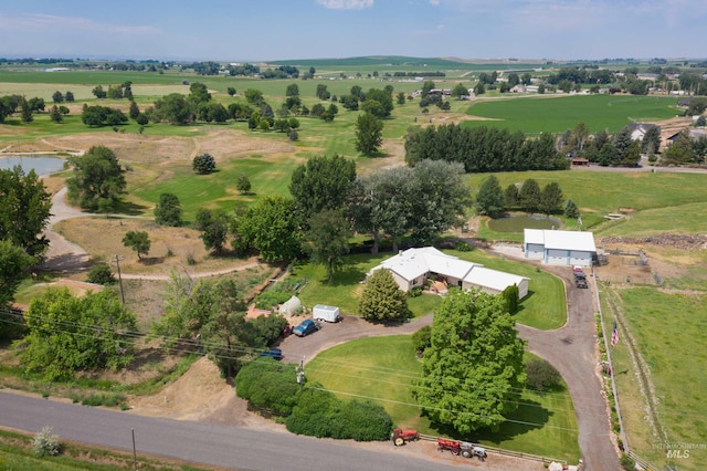 birds eye view of property featuring a rural view