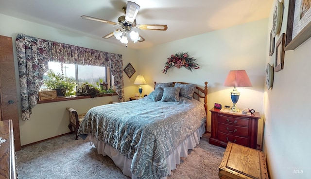 bedroom featuring ceiling fan, carpet flooring, and baseboards
