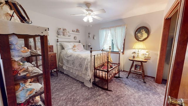 carpeted bedroom with a ceiling fan and baseboards