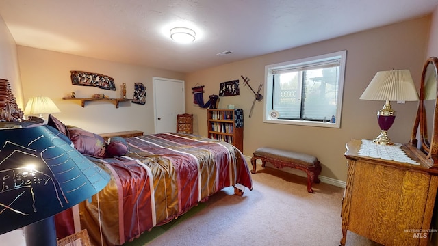 bedroom featuring carpet flooring, visible vents, and baseboards