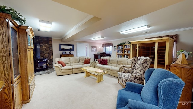 living room with ornamental molding, a wood stove, and light colored carpet