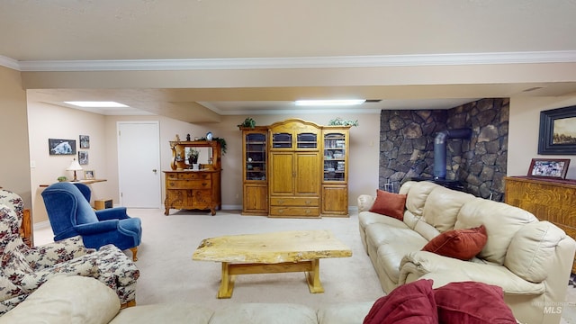 living area with a wood stove, crown molding, and light colored carpet
