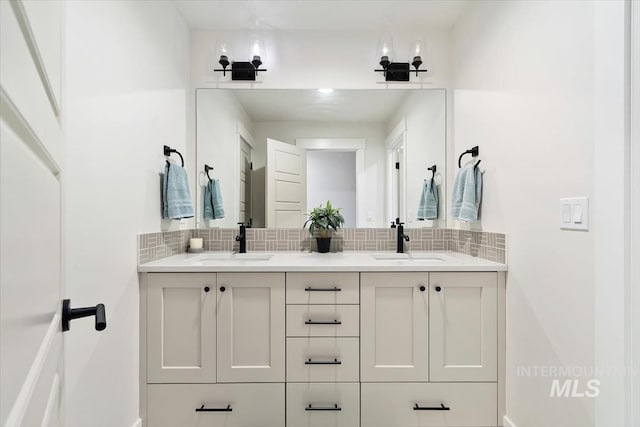 bathroom featuring decorative backsplash and vanity