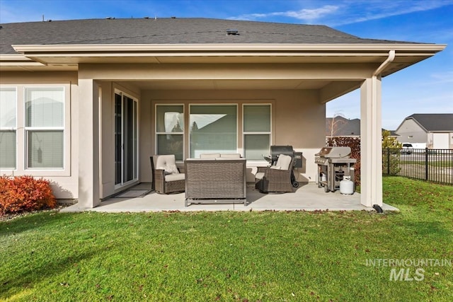 back of property featuring a lawn, an outdoor living space, and a patio