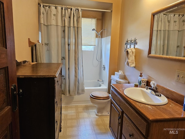 full bathroom featuring shower / bath combination with curtain, vanity, and toilet