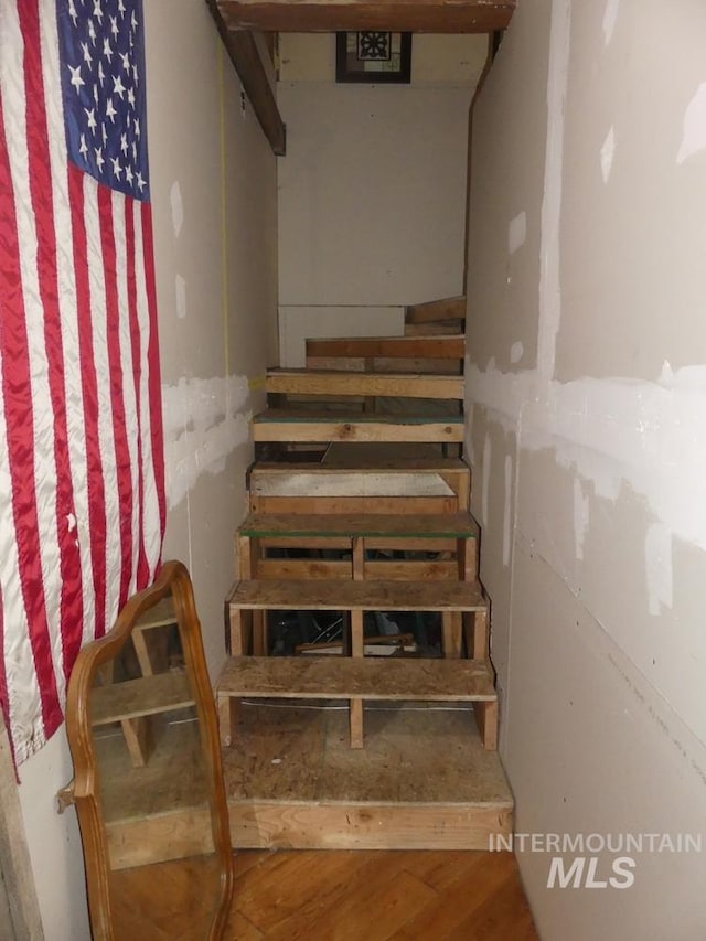 stairway featuring hardwood / wood-style floors