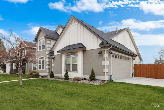 view of side of property with a garage and a lawn