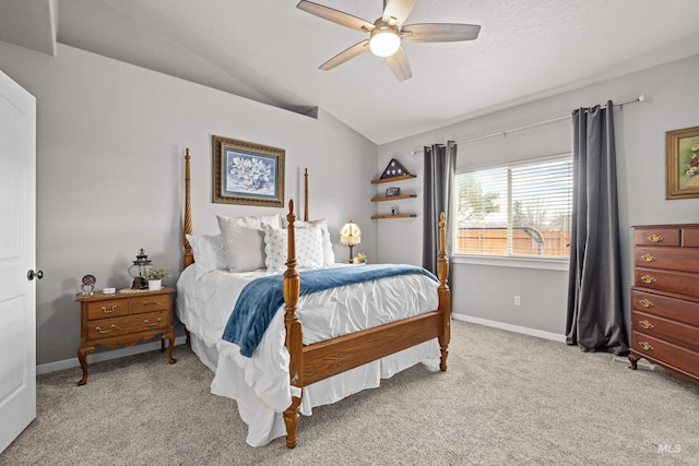 carpeted bedroom with vaulted ceiling and ceiling fan