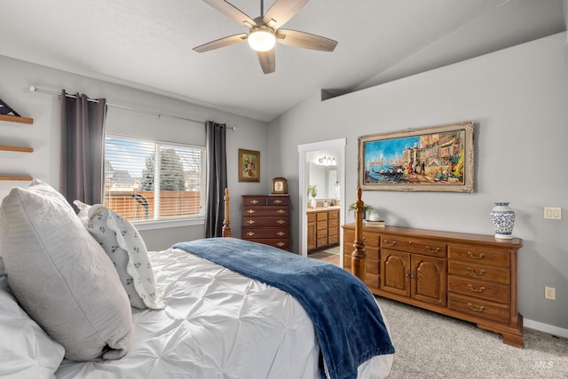 carpeted bedroom featuring ceiling fan, connected bathroom, and vaulted ceiling