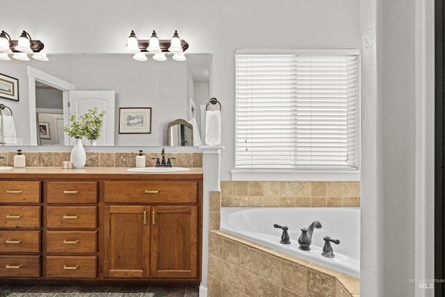 bathroom with vanity and a relaxing tiled tub