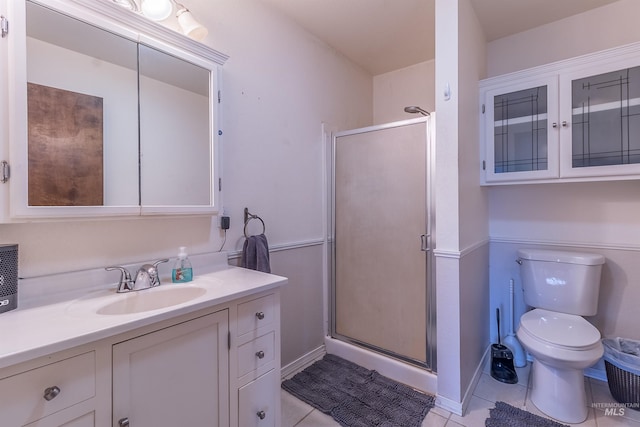 full bathroom with toilet, a stall shower, vanity, and tile patterned flooring