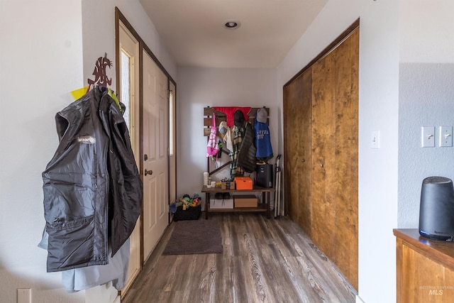 hall with wood finished floors