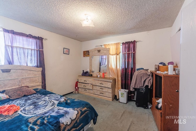 carpeted bedroom with a textured ceiling