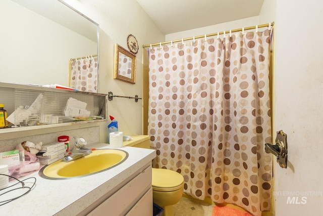bathroom with a shower with shower curtain, toilet, and vanity