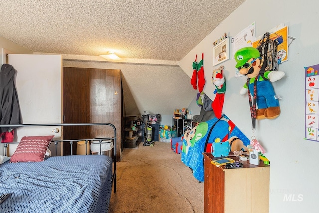 bedroom featuring a textured ceiling and carpet floors