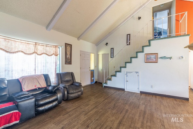 living room with wood finished floors, stairs, beamed ceiling, baseboards, and high vaulted ceiling