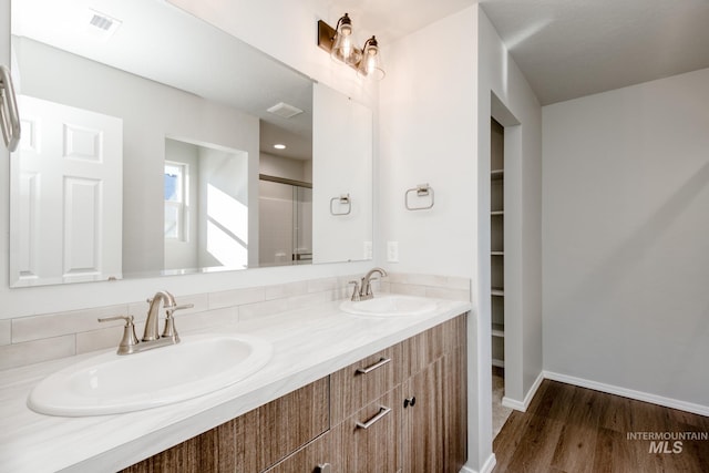 bathroom with vanity and hardwood / wood-style flooring