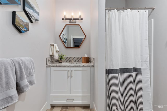 bathroom with vanity and walk in shower