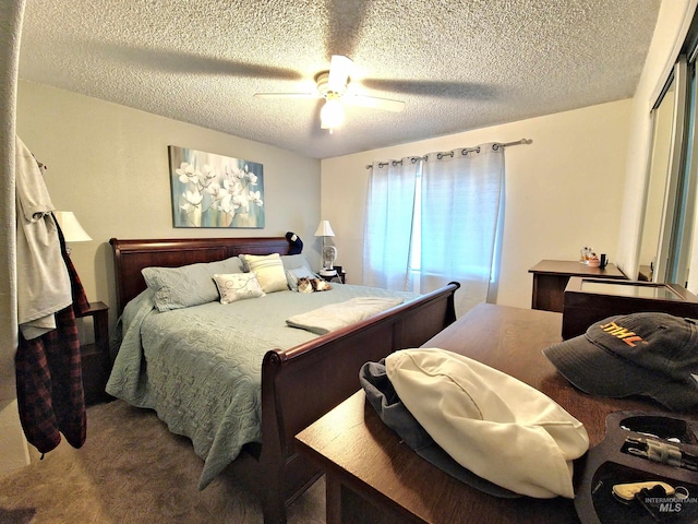 27406 Gem Ln, Juliaetta, ID 83535 - bedroom with a textured ceiling, carpet flooring, and ceiling fan