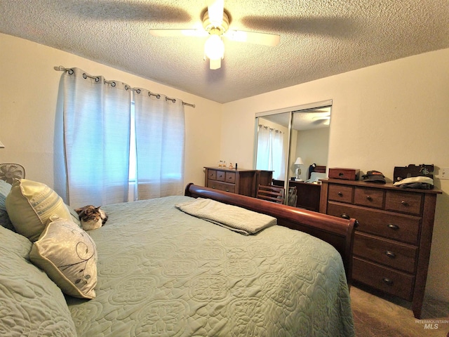 27406 Gem Ln, Juliaetta, ID 83535 - carpeted bedroom featuring a textured ceiling, a closet, and ceiling fan
