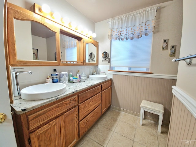 27406 Gem Ln, Juliaetta, ID 83535 - full bathroom featuring wainscoting, double vanity, and tile patterned flooring