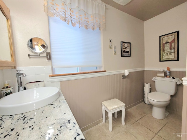 27406 Gem Ln, Juliaetta, ID 83535 - bathroom with wainscoting, tile patterned flooring, and vanity
