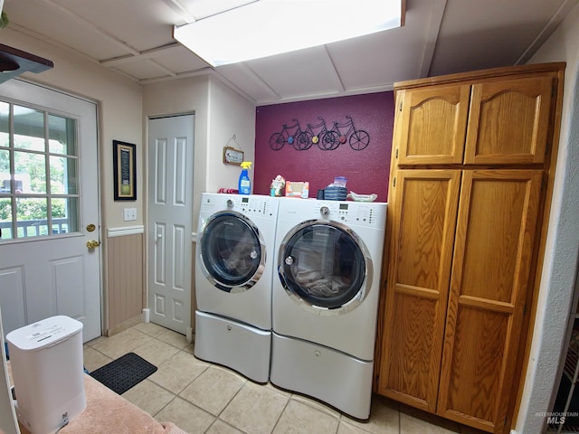 27406 Gem Ln, Juliaetta, ID 83535 - laundry room with cabinet space, washer and clothes dryer, and light tile patterned flooring